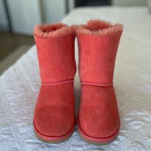 Coral Ugg boots, with back ribbon detail.